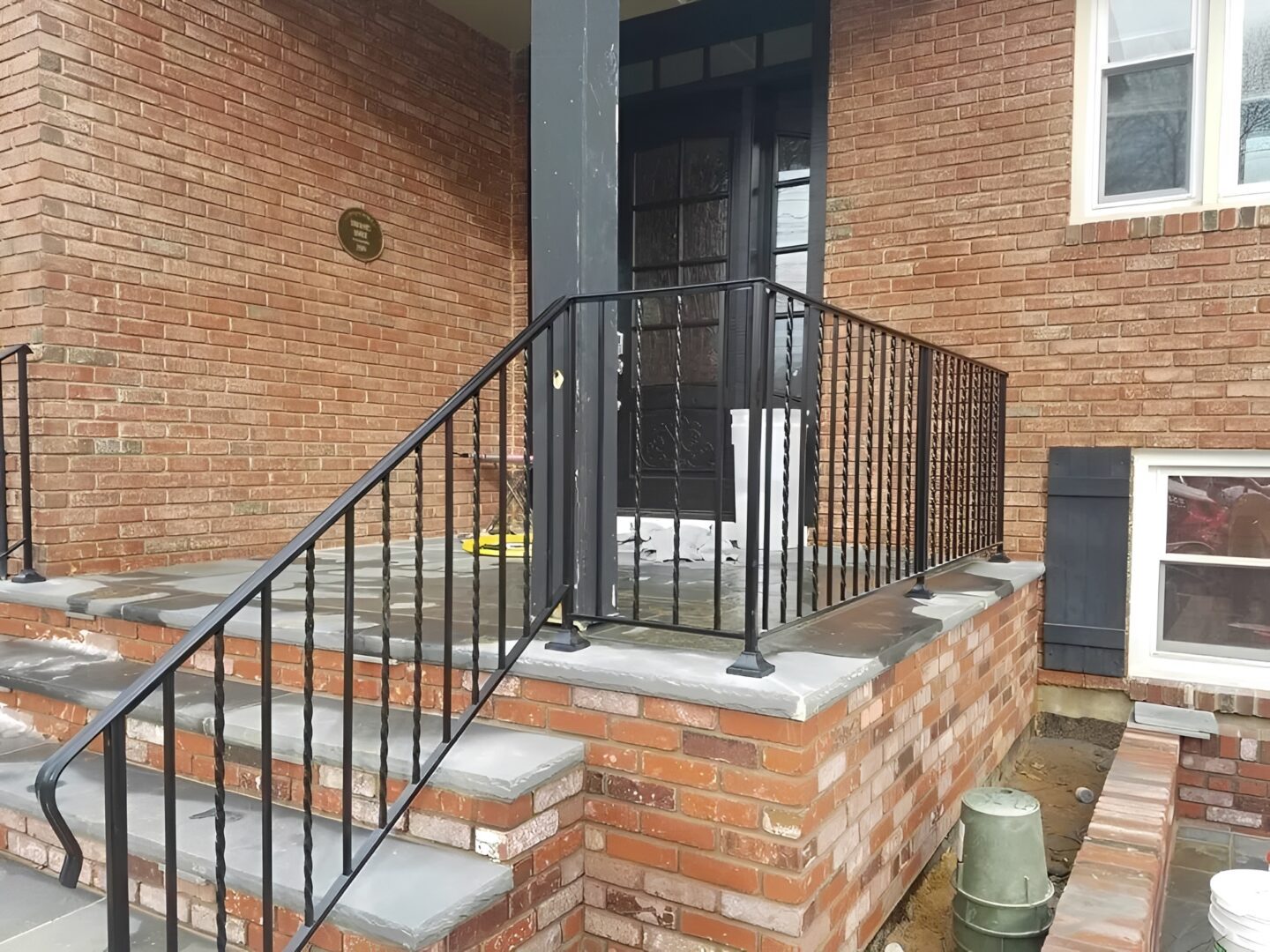 Steps leading to a brick house entrance