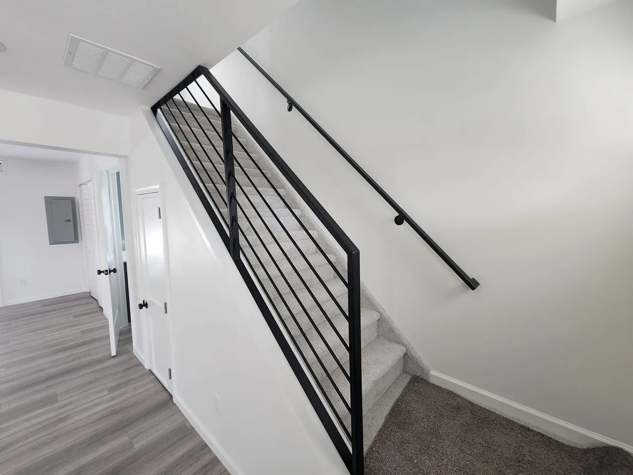 Modern staircase with metal railing